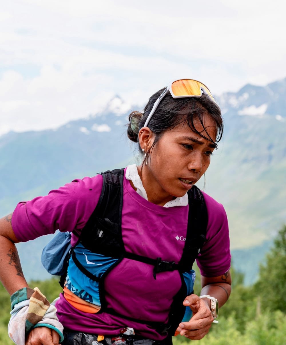 Trisha mid-climb during a trail ultra